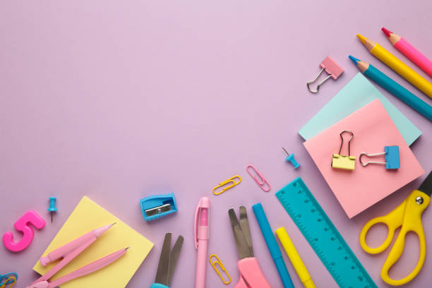 istock Different stationery on purple background, flat lay with space for text. Back to school 1411211923