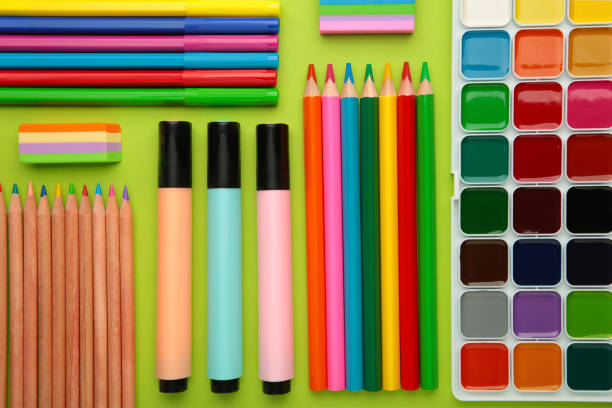 istock School supplies on green background. Top view. 1411212130