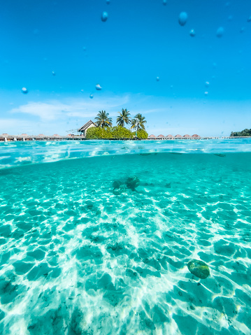 Split view of luxury resort in Maldives