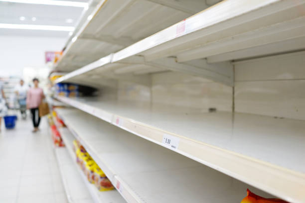 Empty shelves at a grocery store stock photo