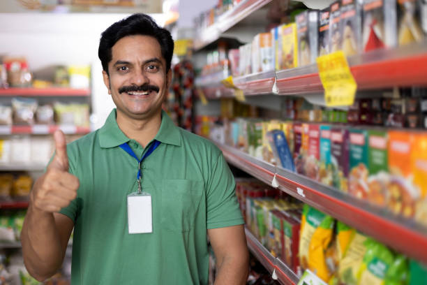 istock Salesman at grocery store products 1411213561