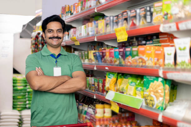 istock Salesman at grocery store products 1411213579