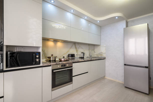 istock Interior of modern trendy white kitchen 1411213773