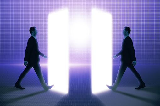 Side view of two young business men walking into metaverse world on glowing background. Meta, technology and innovation concept