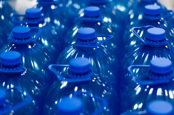 istock Many blue chemical liquid plastic bottles. Group of bottles close up, selective focus blur 1411215866