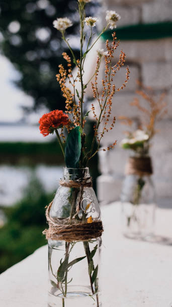 istock Decorative wedding flowers in a glass bottle 1411216383