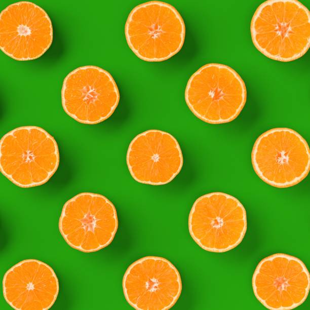 istock Fruit pattern of fresh orange tangerine or mandarin over green background. Flat lay, top view. Pop art design, creative summer concept. Citrus in minimal style.. 1411219212