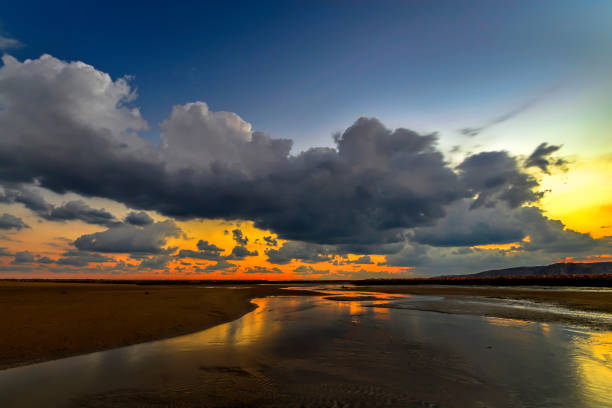 Scenic view of Yitti beach, Sultanate of Oman. Located around 28 kms from the city centre Muscat, Yiti Beach is one of the Beautiful secluded and lesser known beaches in Oman. It is well-known as a camping site also. sunset-in-muscat-oman stock pictures, royalty-free photos & images