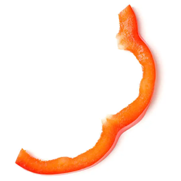 Photo of red pepper slice part isolated over white background cutout. Top view, flat lay..