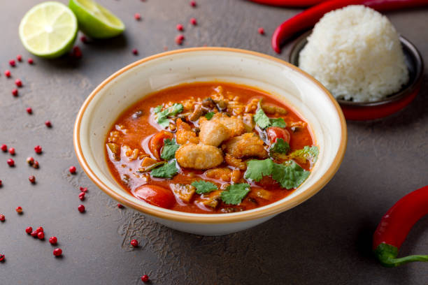 istock Tom Yam soup with chicken on brown table 1411219361