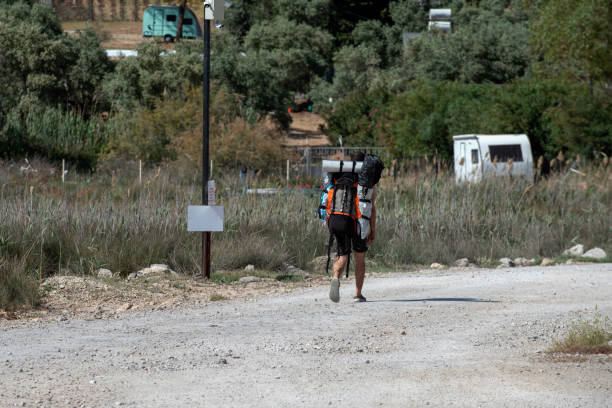 Muğla, Turkey - May 7, 2022 : A young camper leaving the beach