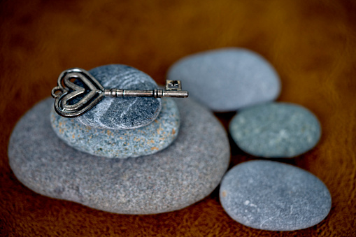 vintage key on pebble stone for concept idea strong empowering inspiration