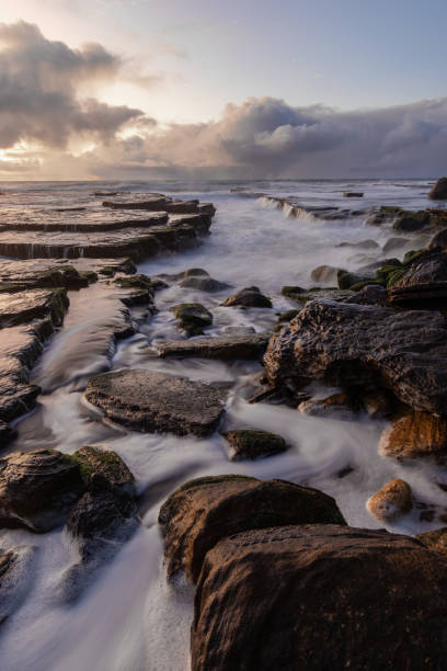 istock Rocky beach in high tide 1411228169