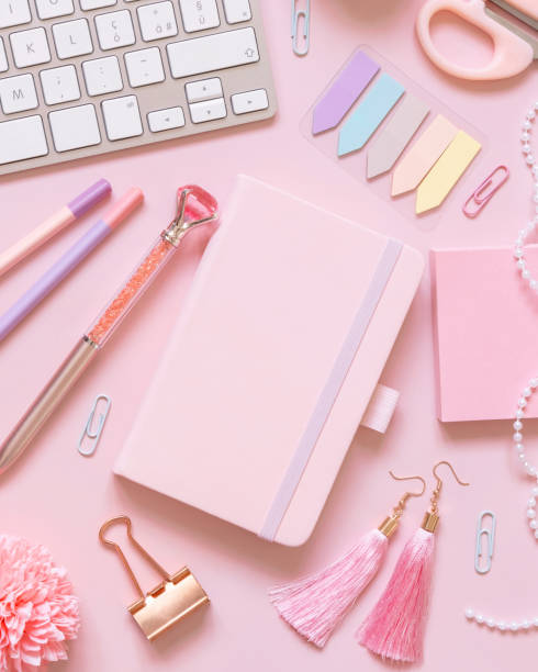 istock Notebook, Pink school girly accessories and keyboard on pastel pink Top view, mockup 1411230702