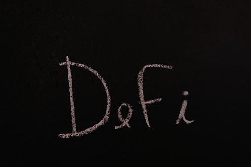 Slate writing board with the word defi written