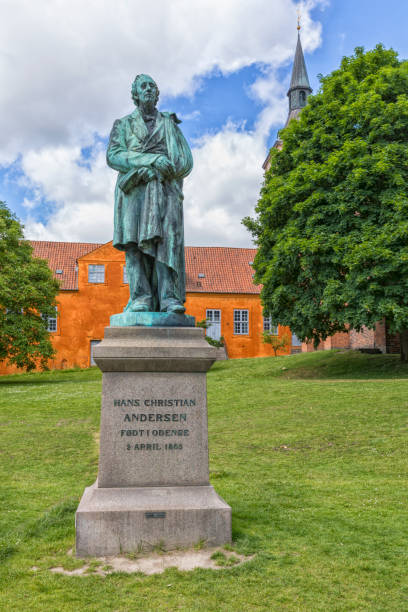 Monument for Hans Christian Andersen at Odense Monument for the Danish author Hans Christian Andersen at Odense statue of hans christian andersen stock pictures, royalty-free photos & images