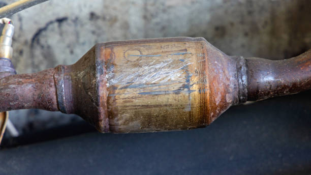 Catalytic Converter Exhaust Damaged Catalytic Converter Exhaust System Scrap Metal Recycling plug adapter stock pictures, royalty-free photos & images