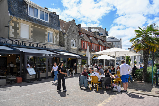 Saint-Cast-le-Guildo, France, July 4, 2022- Tourists on the Square Pellion in Saint-Cast-le-Guildo, Brittany