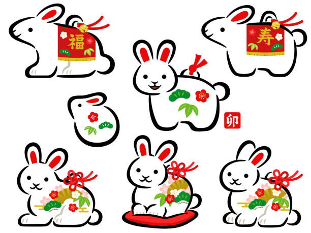 Hand drawn style illustration set of white rabbit earthenware bells for the New Year celebration in Japan The text on the stamp mean rabbit, and on the rabbit's body mean happiness and congratulations. zabuton stock illustrations