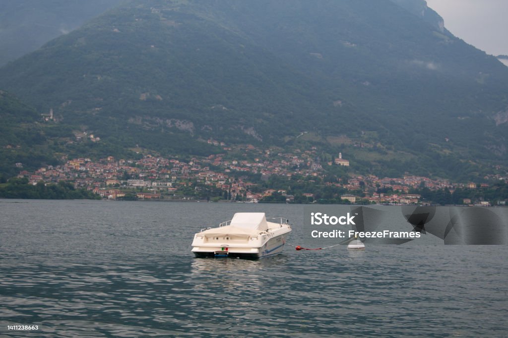 Boats and Boat dock on Lake Como, Italy from the town of Lezzeno- Varenna, Lombardy region, Europe, Alps Lake Como, Italy from the town of Lezzeno- Varenna, Lombardy region, Europe, Alps Architectural Dome Stock Photo