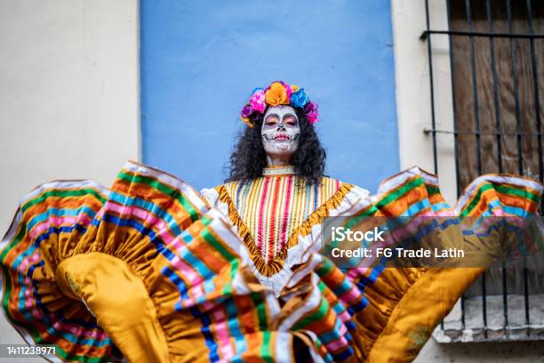 Portrait Of A Mid Adult Woman Dancing And Celebrating The Day Of The Dead Stock Photo - Download Image Now