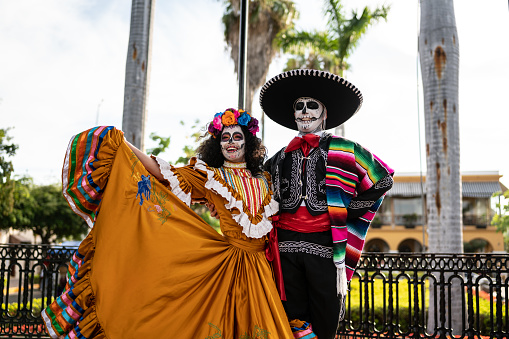 Couple dancing and celebrating the day of the dead