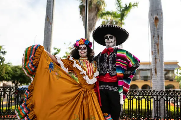 Photo of Couple dancing and celebrating the day of the dead
