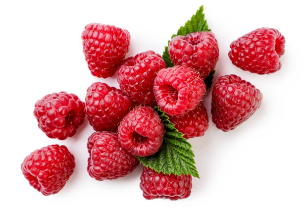 istock Raspberries with leaves close-up on a white background. Top view 1411243671