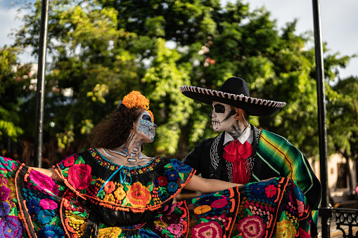 Couple dancing and celebrating the day of the dead