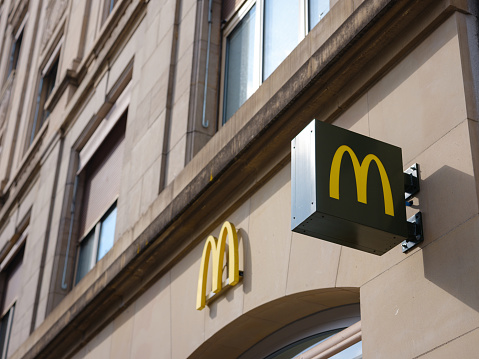 Basel, Switzerland - July 4 2022: McDonald's Restaurants of Basel. McDonald's logo. McDonald's is the world's largest chain of hamburger fast food restaurants