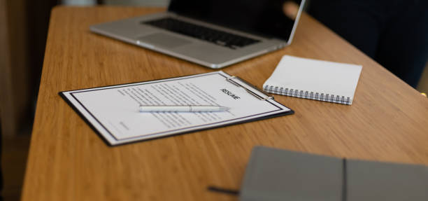 istock Job Application, Recruitment and Interview Ideas. Close up of resume documents on office desk. 1411248897
