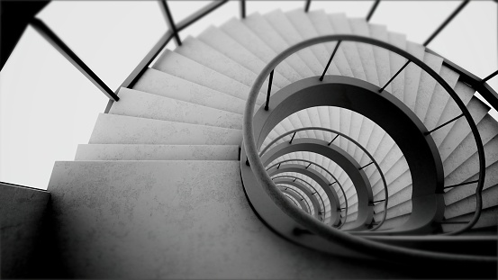 Beautiful white snail stair from the top view in a monochrome color scheme. White staircase. White modern spiral staircase. Snake looking snail stair