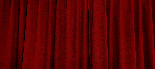 close up view of dark red curtain in thin and thick vertical folds made of black out sackcloth fabric, panoramic view of drapery use as background. abstract theatre backgrounds and wallpapers.