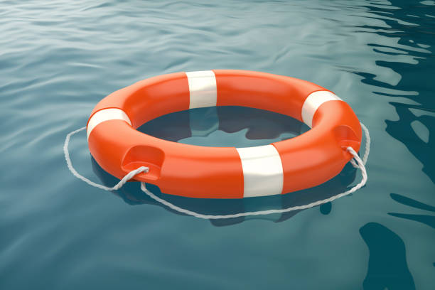 istock Orange lifebuoy ring in the ocean 1411253363