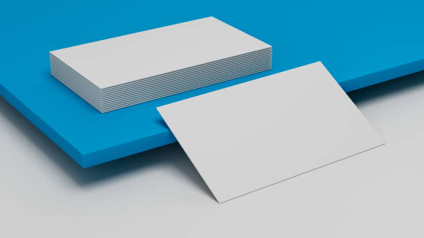 istock White business card Mockup laying on blue background. Visiting card laying on colored surface 1411253459