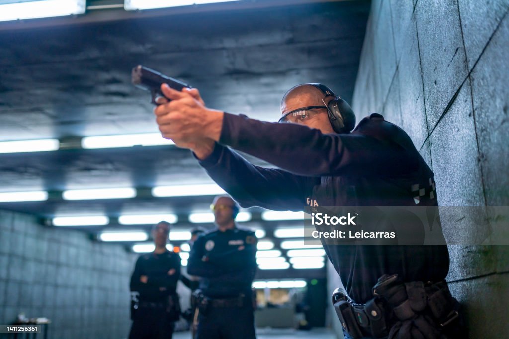 Police training in shooting gallery with short weapon. Police Force Stock Photo