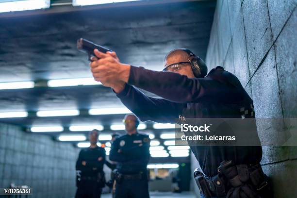 Police Training In Shooting Gallery With Short Weapon Stock Photo - Download Image Now
