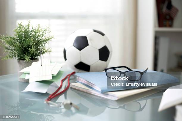 Soccer Ball On Desk With Books And Whistle Stock Photo - Download Image Now - Book, Sport, Heap