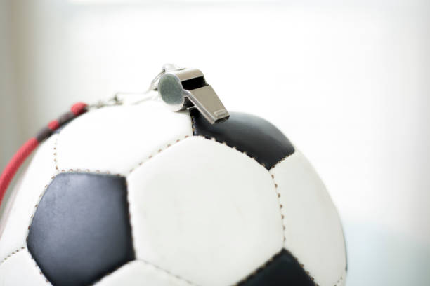 istock Soccer Ball closeup with whistle on top 1411256675