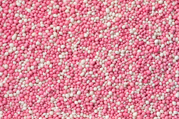 istock Traditional Dutch pink anise sprinkles full frame close up 1411257019