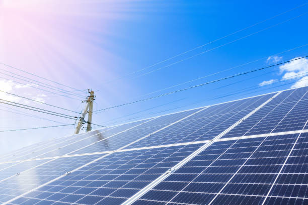 istock Solar panels on the sky background. Clean green energy concept 1411257100