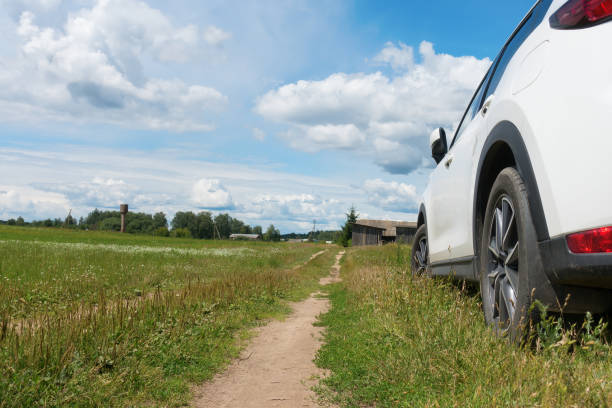istock white car stands on the side of  road 1411257273