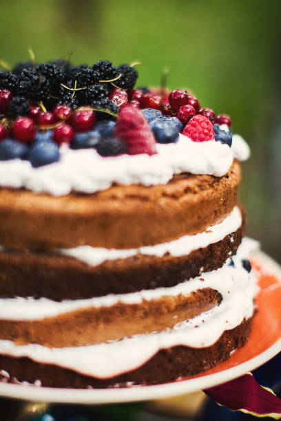 istock Multilevel wedding cake decorated with a variety of berries 1411261944