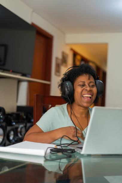 istock beautiful older woman receives classes in virtual mode 1411263068