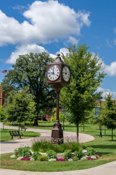 Landmark Clock and Path on the Campus of the University of Wisconsin-Eau Claire Landmark clock and path at the University of Wisconsin-Eau Claire. university of wisconsin eau claire stock pictures, royalty-free photos & images