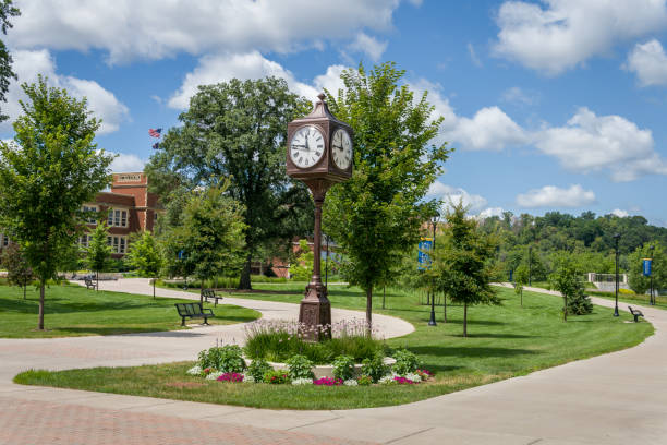 Landmark Clock and Path on the Campus of the University of Wisconsin-Eau Claire Landmark clock and path at the University of Wisconsin-Eau Claire. university of wisconsin eau claire stock pictures, royalty-free photos & images