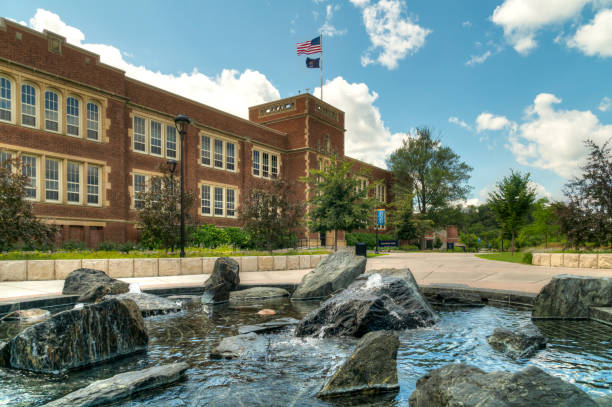 Schofield Hall and Fountain on the Campus of the University of Wisconsin-Eau Claire Schofield Hall and fountain at the University of Wisconsin-Eau Claire. university of wisconsin eau claire stock pictures, royalty-free photos & images