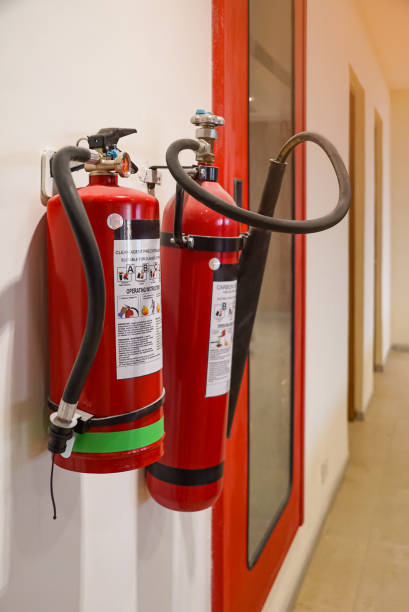 istock Fire extinguisher and gas pump system on the wall. Powerful emergency fire extinguisher equipment. Fire retardant. Fireproof. 1411267990
