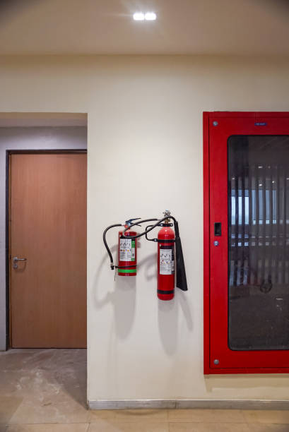 istock Fire extinguisher and gas pump system on the wall. Powerful emergency fire extinguisher equipment. Fire retardant. Fireproof. 1411267991