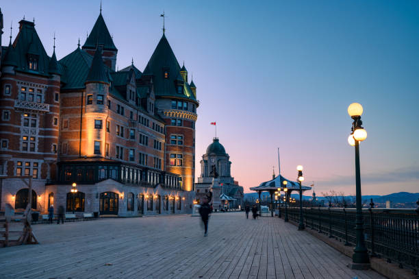 People walking on Dufferin terrace at dusk